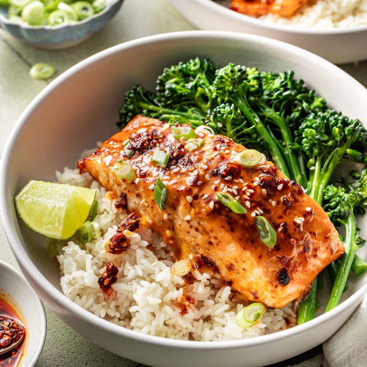 Chili crisp salmon served with rice and broccoli in a bowl.