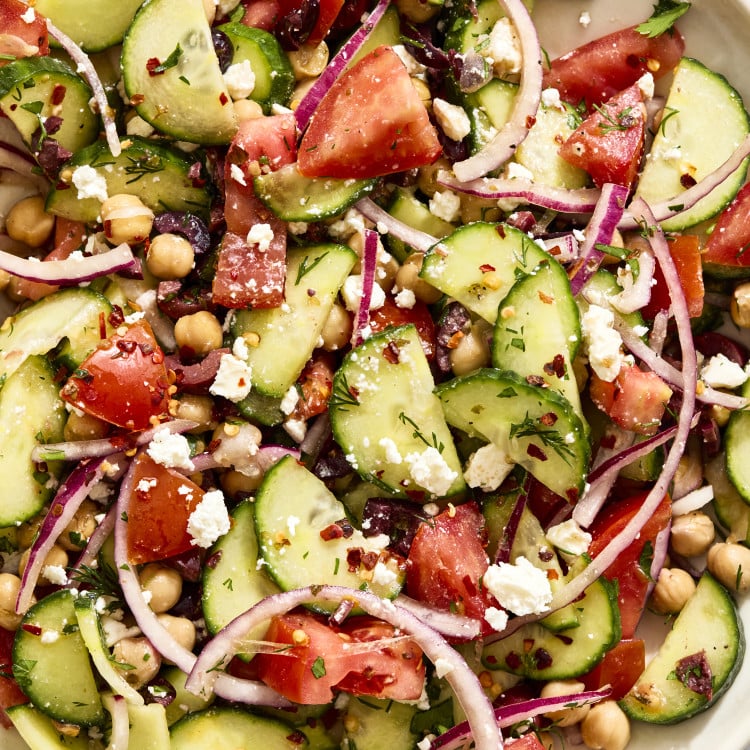 Cucumber tomato salad tossed and ready to serve.