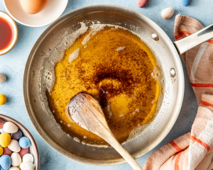 Browning the butter in a skillet for the cadbury cookies.