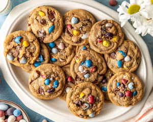 Cadbury cookies piled onto oval serving plate once cooled.