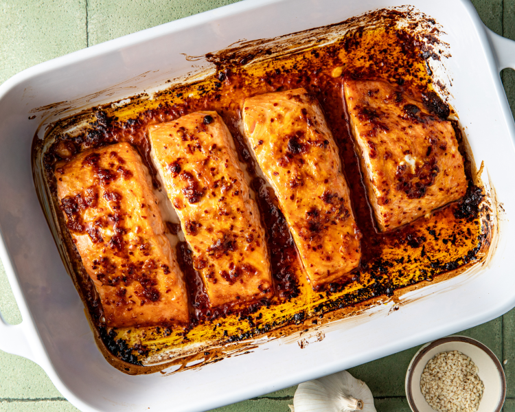 Chili crisp salmon cooked in a 9x13 baking dish.