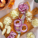 All the different variations of how to cut on onion displayed on a cutting board.