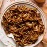 Caramelized onions on a plate with a fork.