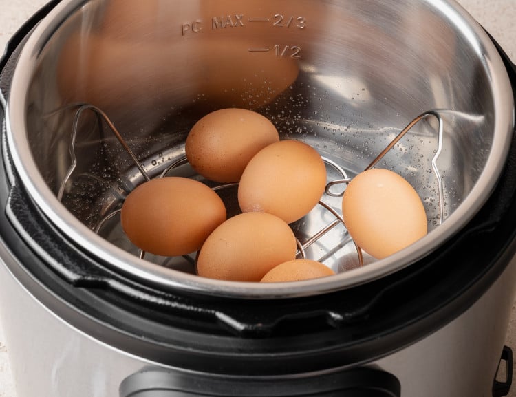 Eggs placed in the instant pot for cooking.