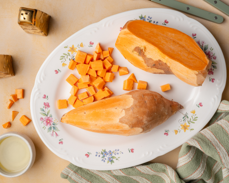 Peeling two big sweet potatoes and dicing them into small cubes.