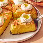 Spatula picking up a slice of lemon olive oil cake.