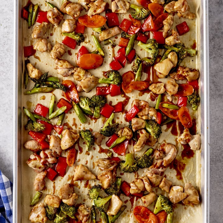 Sesame chicken and veggies baked on sheet pan.