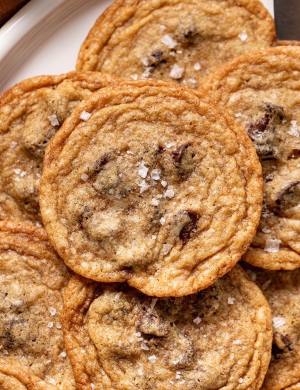 Upclose photo of tate's copycat chocolate chip cookie sprinkled with flake salt.