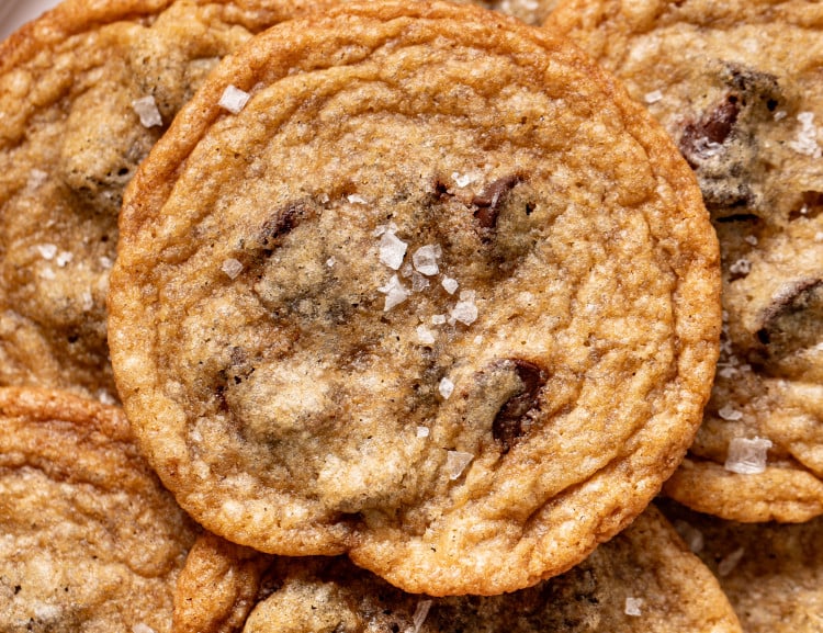 Upclose photo of tate's copycat chocolate chip cookie sprinkled with flake salt.