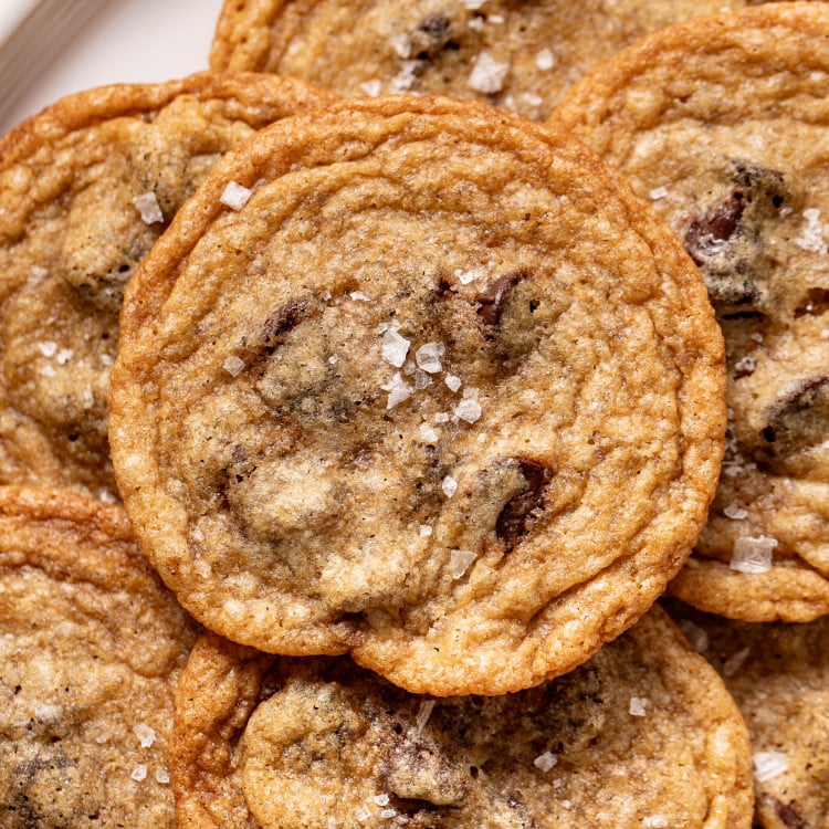 Upclose photo of tate's copycat chocolate chip cookie sprinkled with flake salt.
