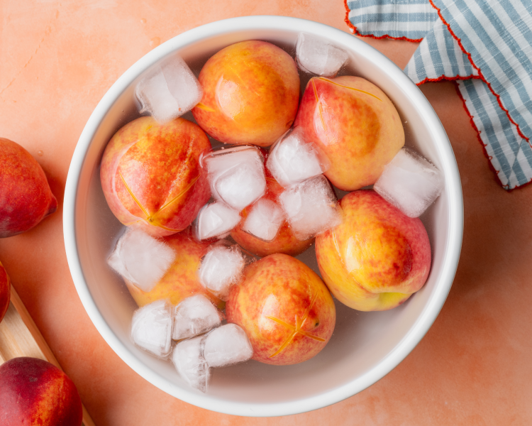 Peaches immediately transferred to an ice bath after blanching.