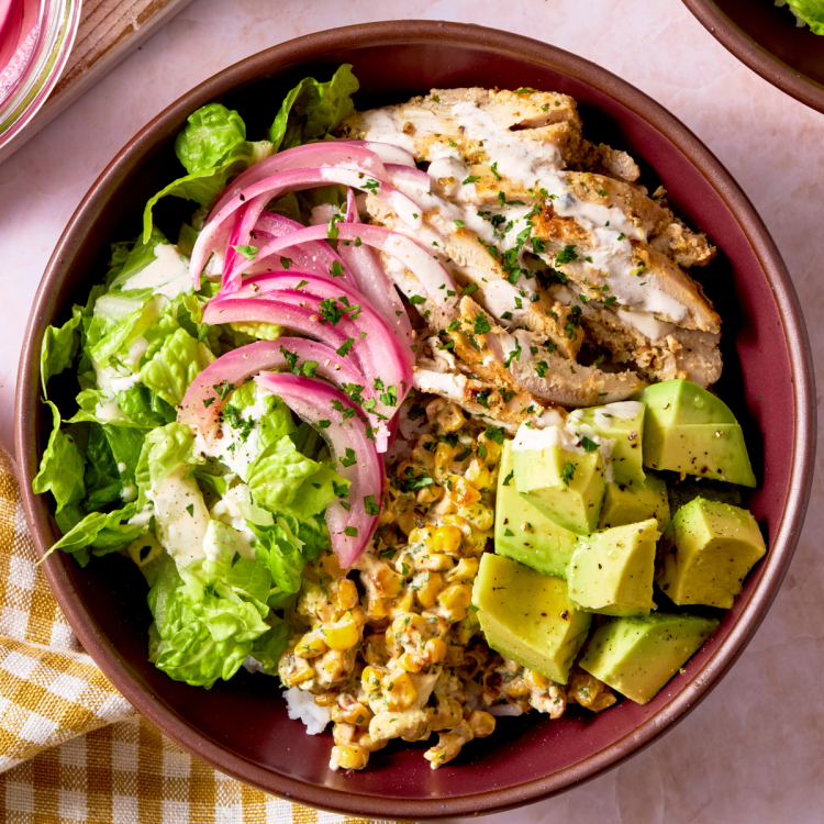 Street corn bowl assembled and topped with toppings.