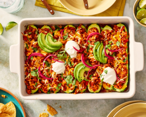 Taco zucchini boats baked and garnished with toppings.