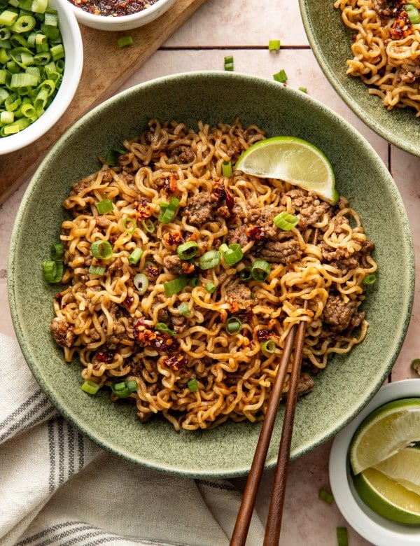 Chili crisp beef ramen noodles served in a bowl with chopsticks.