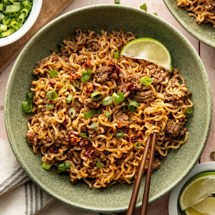 Chili crisp beef ramen noodles served in a bowl with chopsticks.