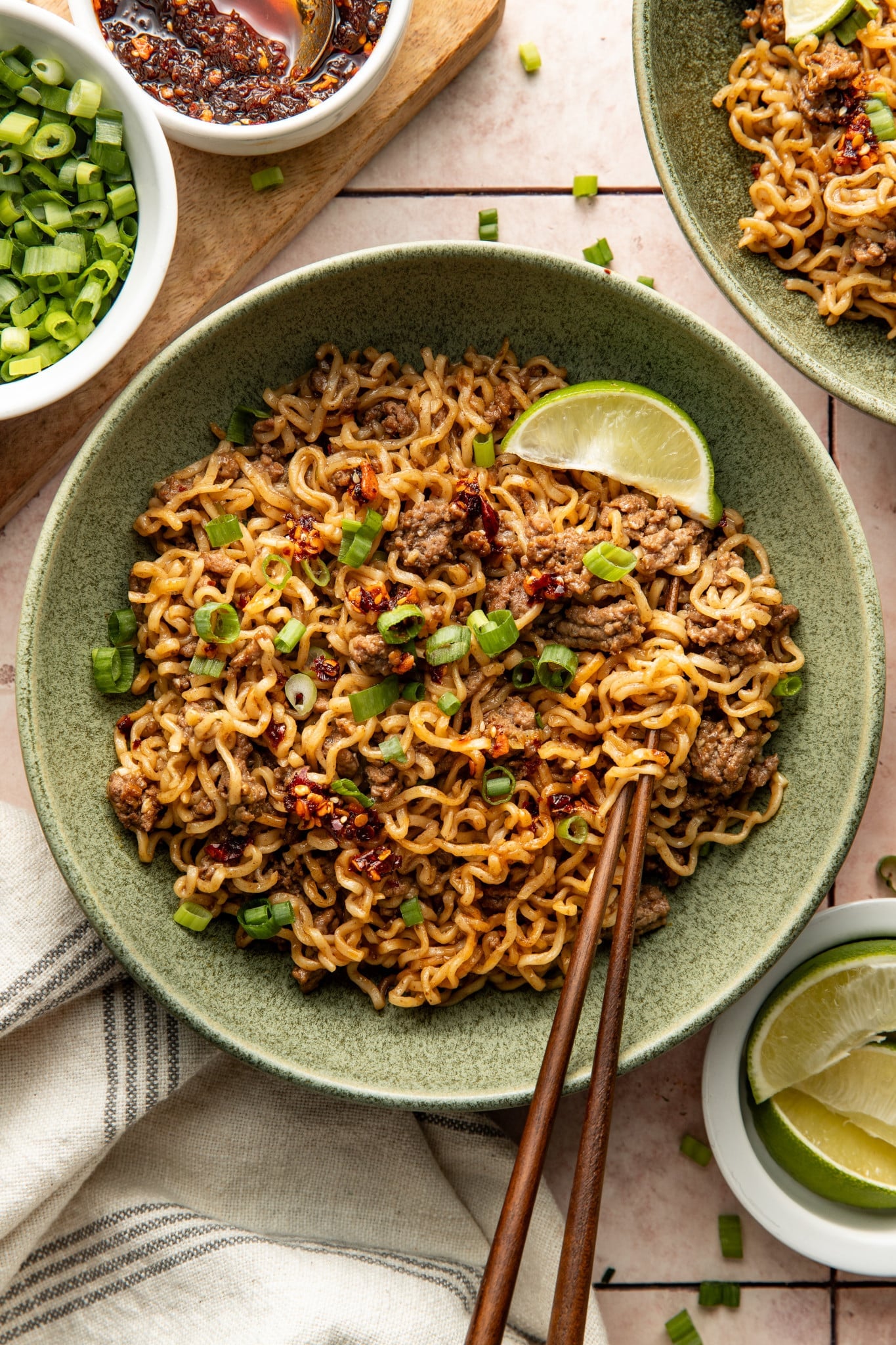 Chili crisp beef ramen noodles served in a bowl with chopsticks.