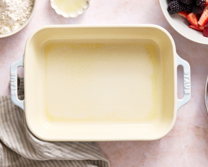 Ceramic baking dish sprayed with cooking spray before adding berry mixture.