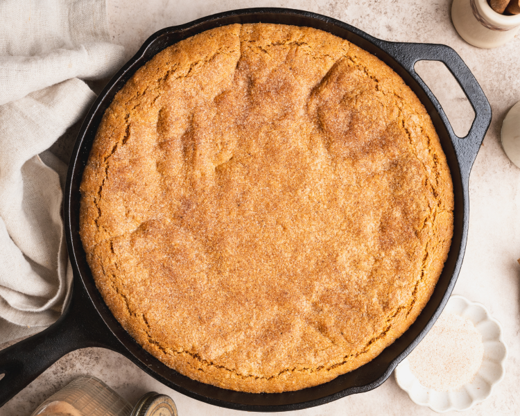 Brown butter snickerdoodle skillet cookie baked in cast iron skillet.