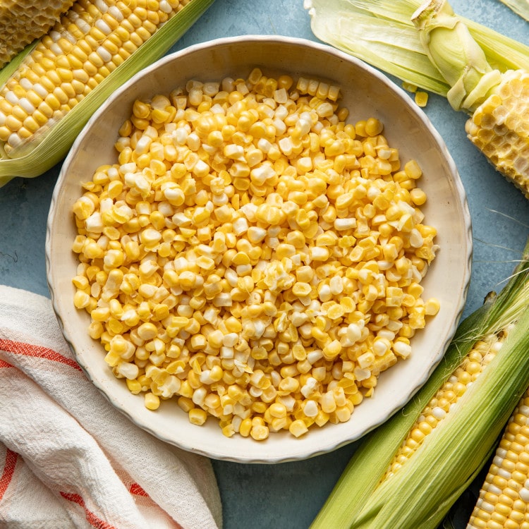 Corn kernels cut off the cob and placed in a bowl.