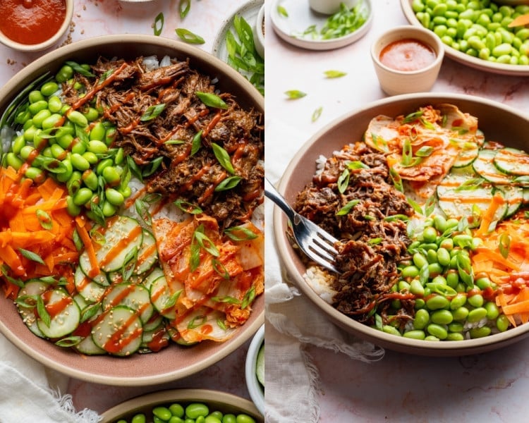 Finished Korean-inspired beef bowls topped with shredded beef, rice, edamame, cucumber salad, carrots, kimchi, sesame seeds, green onions, and sriracha drizzle.