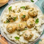 Chicken piccata meatball served on top of mashed potatoes.