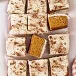Pumpkins spice sheet cake cut into pieces with two pieces turned on their sides to see inside of cake crumb.