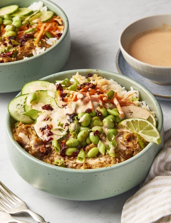 Chili crisp chicken bowls assembled with toppings.