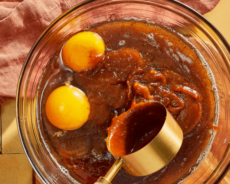 Adding the wet ingredients to the butter and sugars.