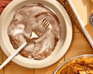 Whisking together the cinnamon and sugar for cinnamon sugar mixture.