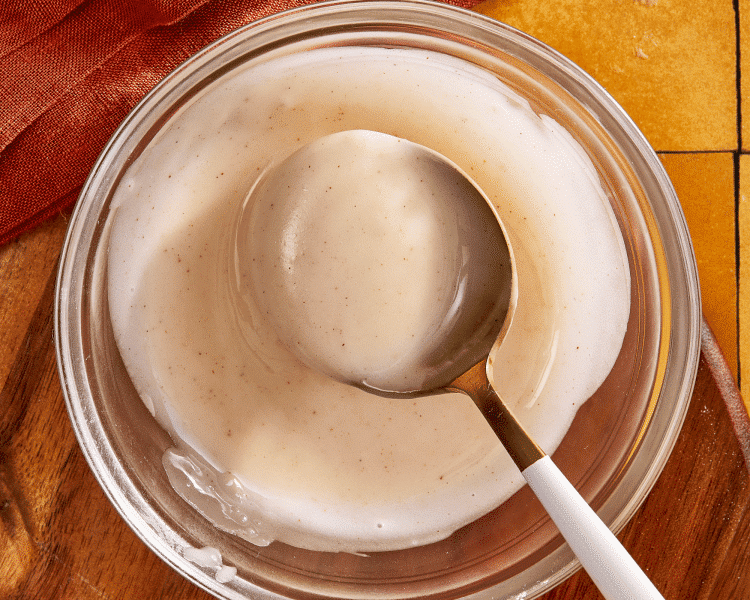 Whisking together ingredients for pumpkin spice glaze.