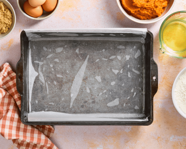 9x13 baking pan lined with parchment paper and sprayed with cooking spray.