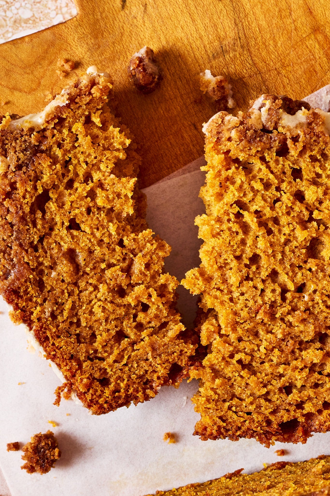 Close-up of Pumpkin Streusel Bread pulled apart to show its soft, moist and tender pumpkin crumb.