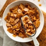 Scoop digging into bowl of homemade toffee bits.