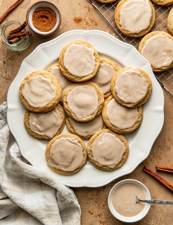 Baked and iced pop tart cookies on large white plate.