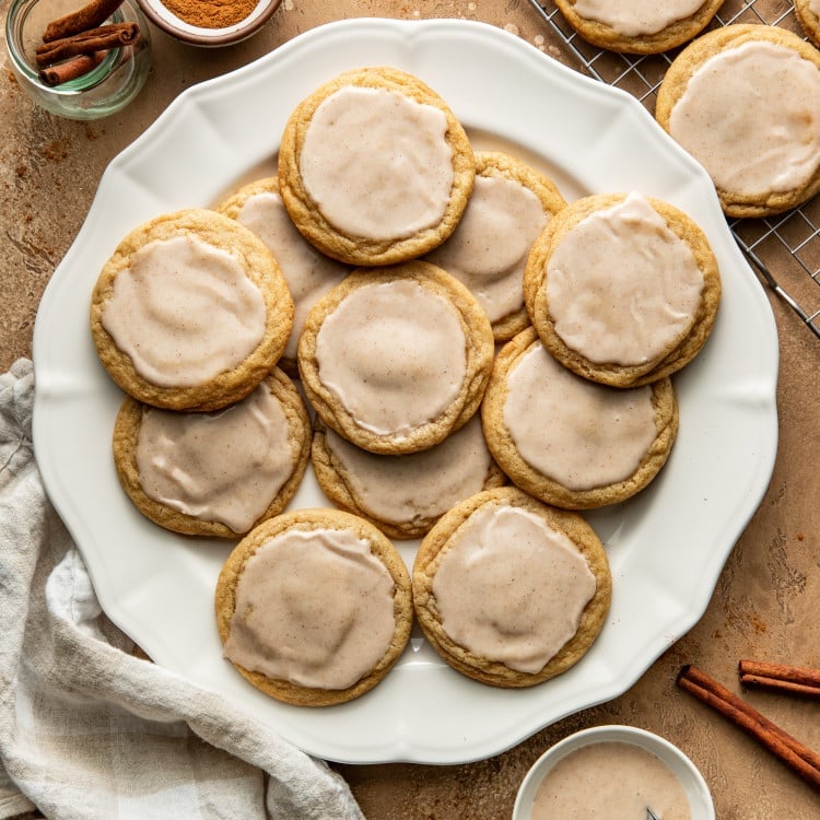 Baked and iced pop tart cookies on large white plate.