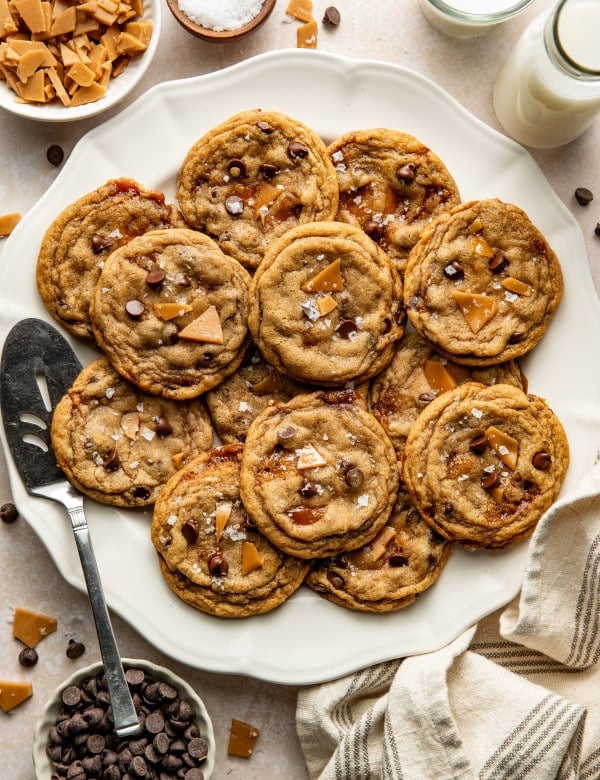 Toffee chocolate chip cookies baked and served on round plate.