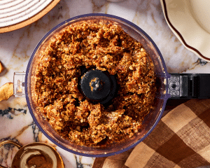 Apple pie energy bite mixture pulsed in a food processor.