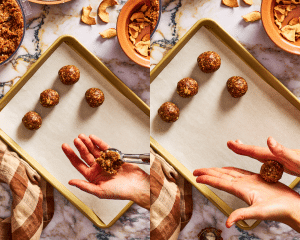 Scooping apple pie energy bite mixture with cookie scoop then rolling in hands to form a round ball.